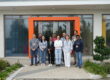 Group smiling in front of the CYRIC building in Cyprus