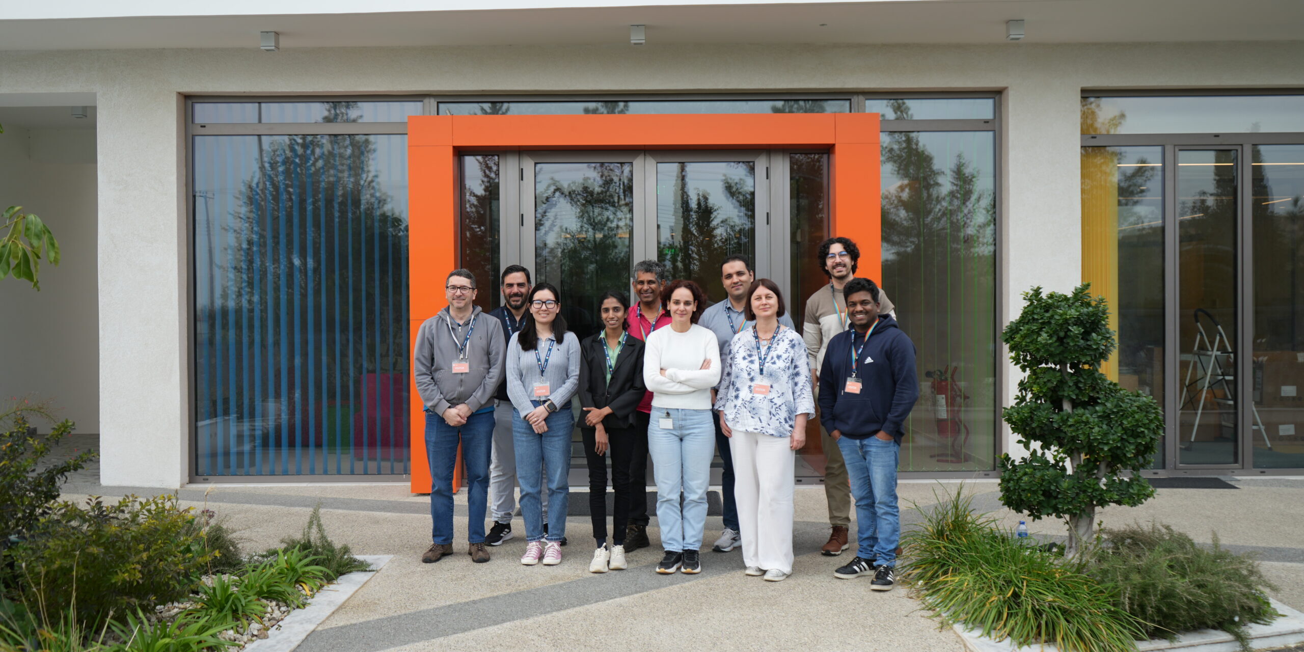 Group smiling in front of the CYRIC building in Cyprus