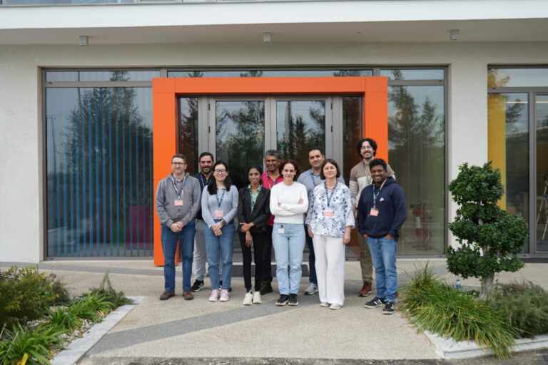 Group smiling in front of the CYRIC building in Cyprus