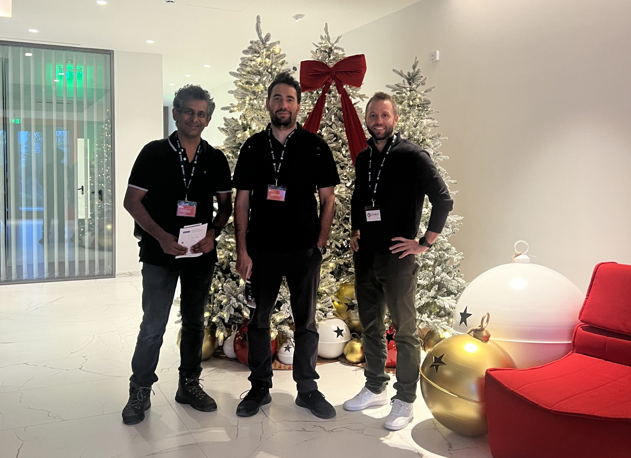 Arun Narayanan posing with colleagues in front of a Christmas tree while on secondment in Cyprus